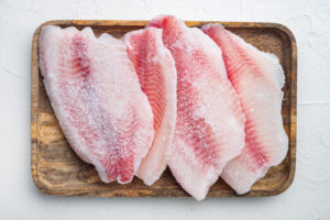 Frozen fish fillet set, on white background, top view