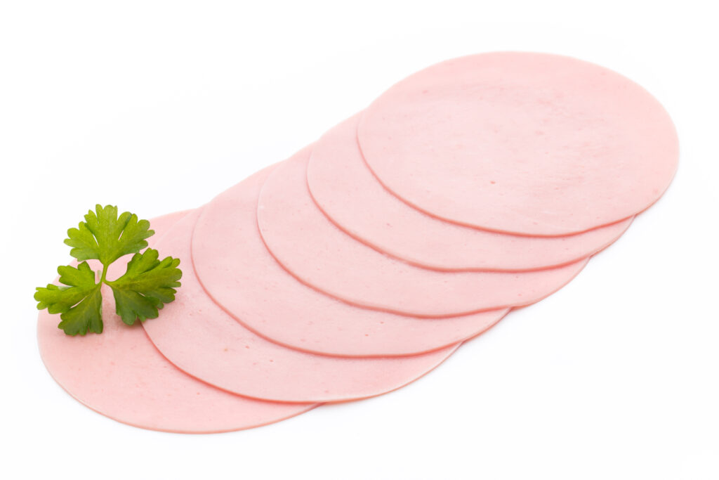 Sliced turkey ham isolated on white background, top view